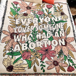 Load image into Gallery viewer, Cotton throw blanket with fringe and floral design with "Everyone Loves Someone Who Had An Abortion"