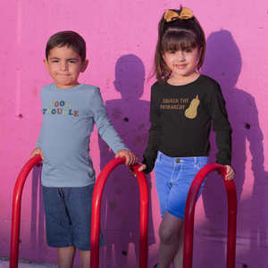 Photo of little girl wearing the Squash The Patriarchy long sleeve tee with a little boy wearing the Good Trouble longsleeve tee.