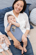 Load image into Gallery viewer, Mom holds a baby in light blue onesie with "We Need Equality Meow!" design