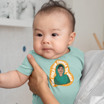 Load image into Gallery viewer, Baby wearing Malala Onesie from The Outrage