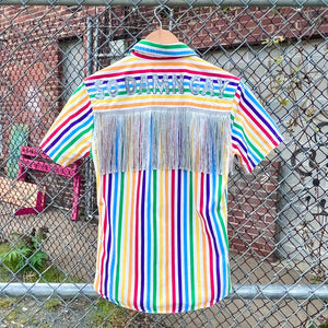 Rainbow thrifted button up with silver fringe and 'So Damn Gay" in silver glitter across the shoulders 