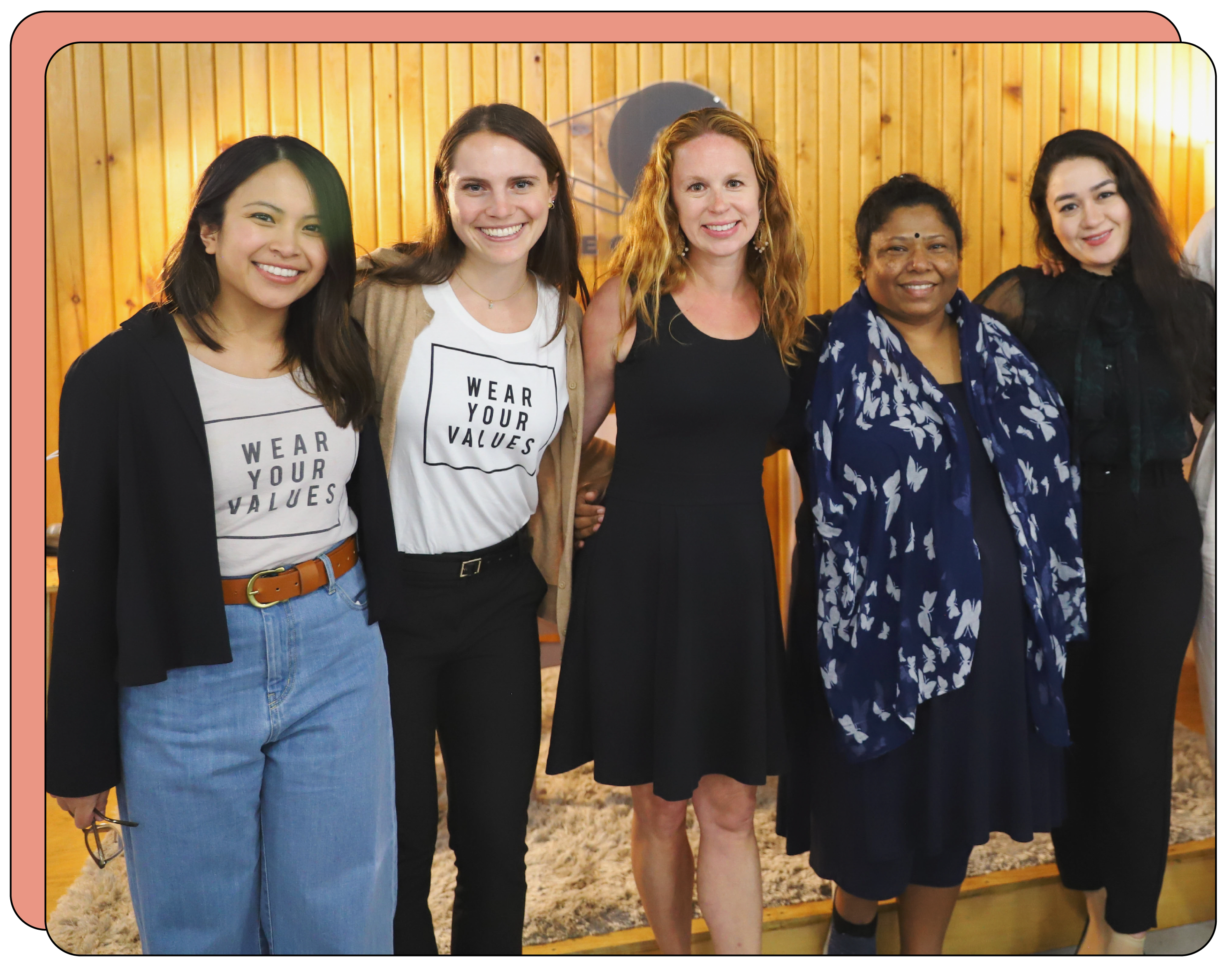 Group photo of five people smiling together.