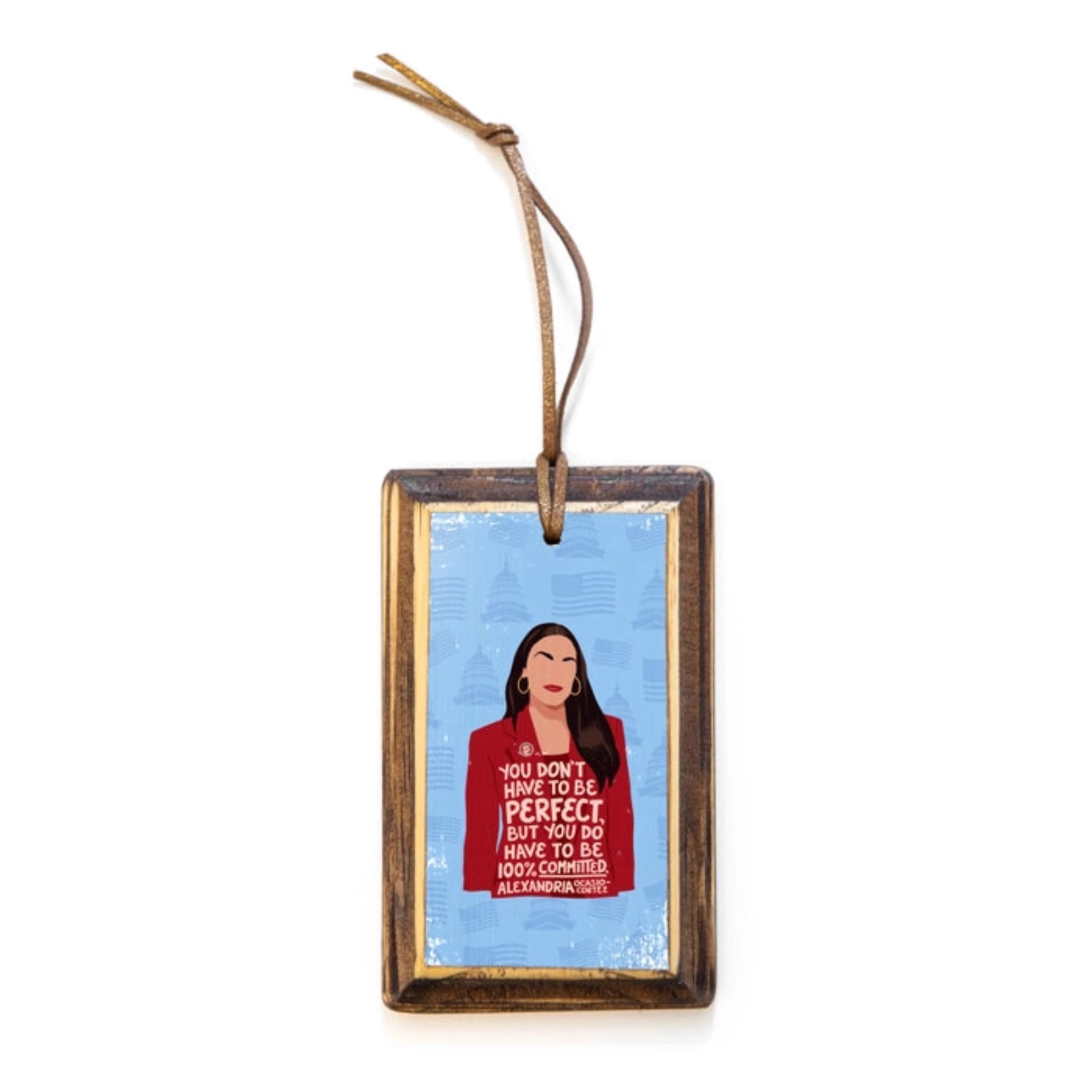 Rectangular wooden ornament with illustrated portrait of Alexandra Ocasio-Cortez and quote 