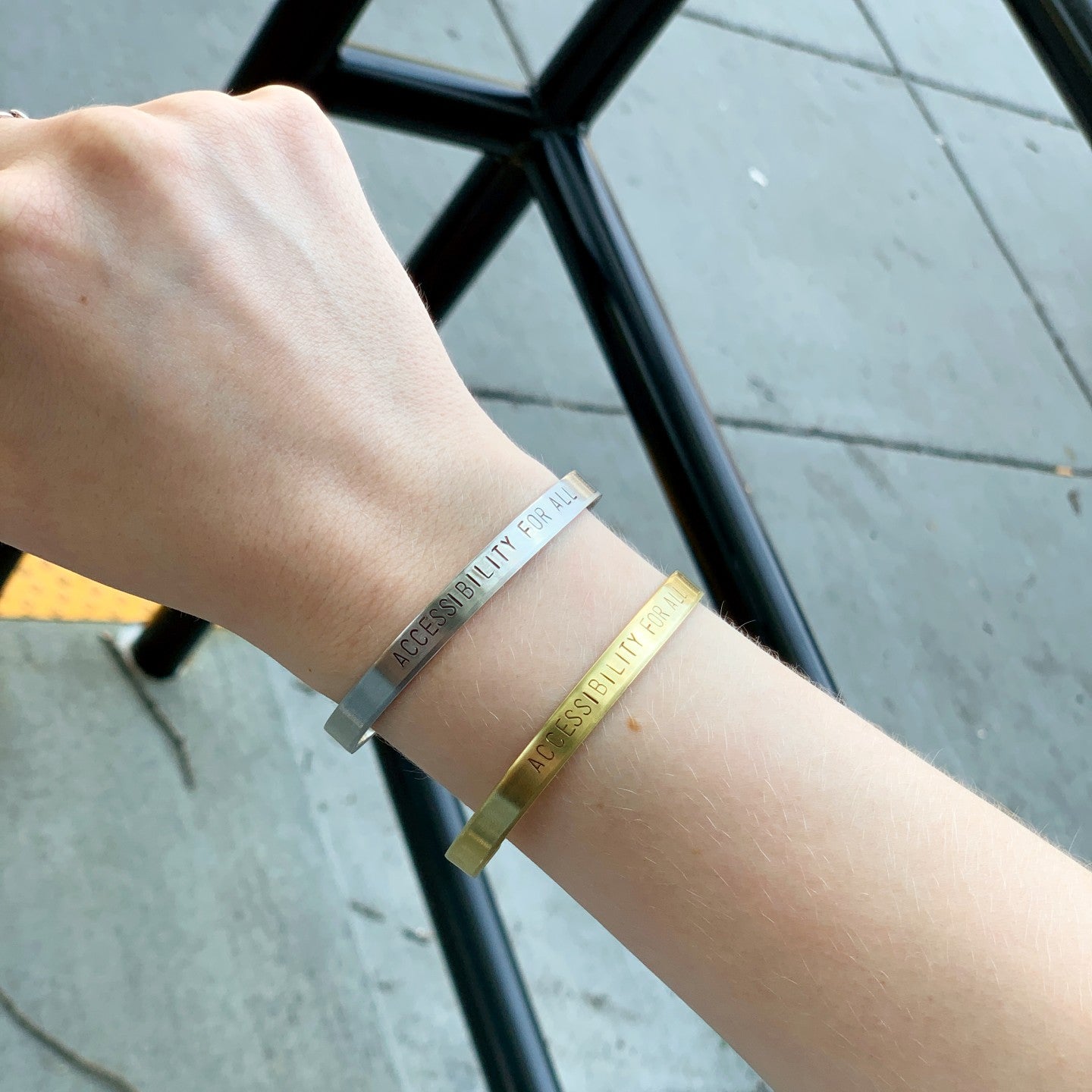 Accessibility for All Bracelets in Aluminum and Brass on a person's arm
