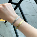 Load image into Gallery viewer, Accessibility for All Bracelets in Aluminum and Brass on a person&#39;s arm
