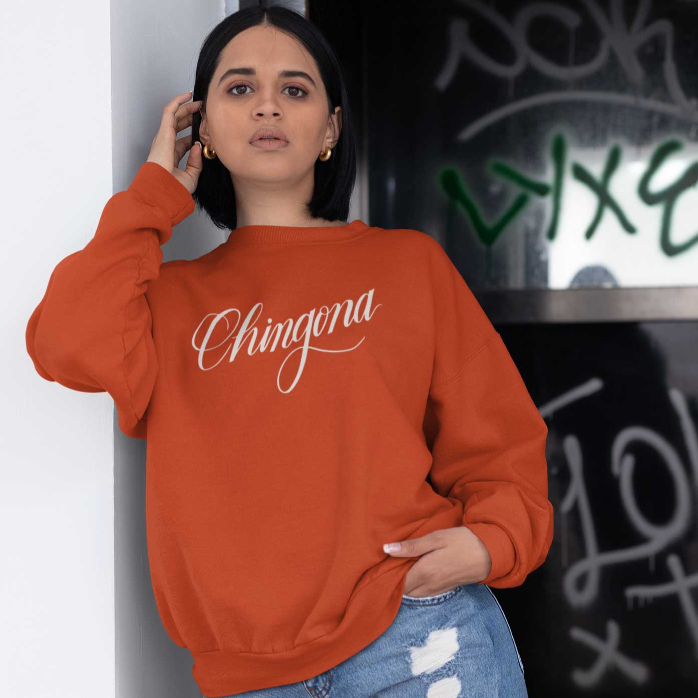 Person wearing Chingona sweatshirt in color brick