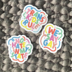 Load image into Gallery viewer, Photo of the &quot;Trans Kids Rule&quot; &quot;We Say Gay&quot; and &quot;No Hate In My State&quot; stickers.
