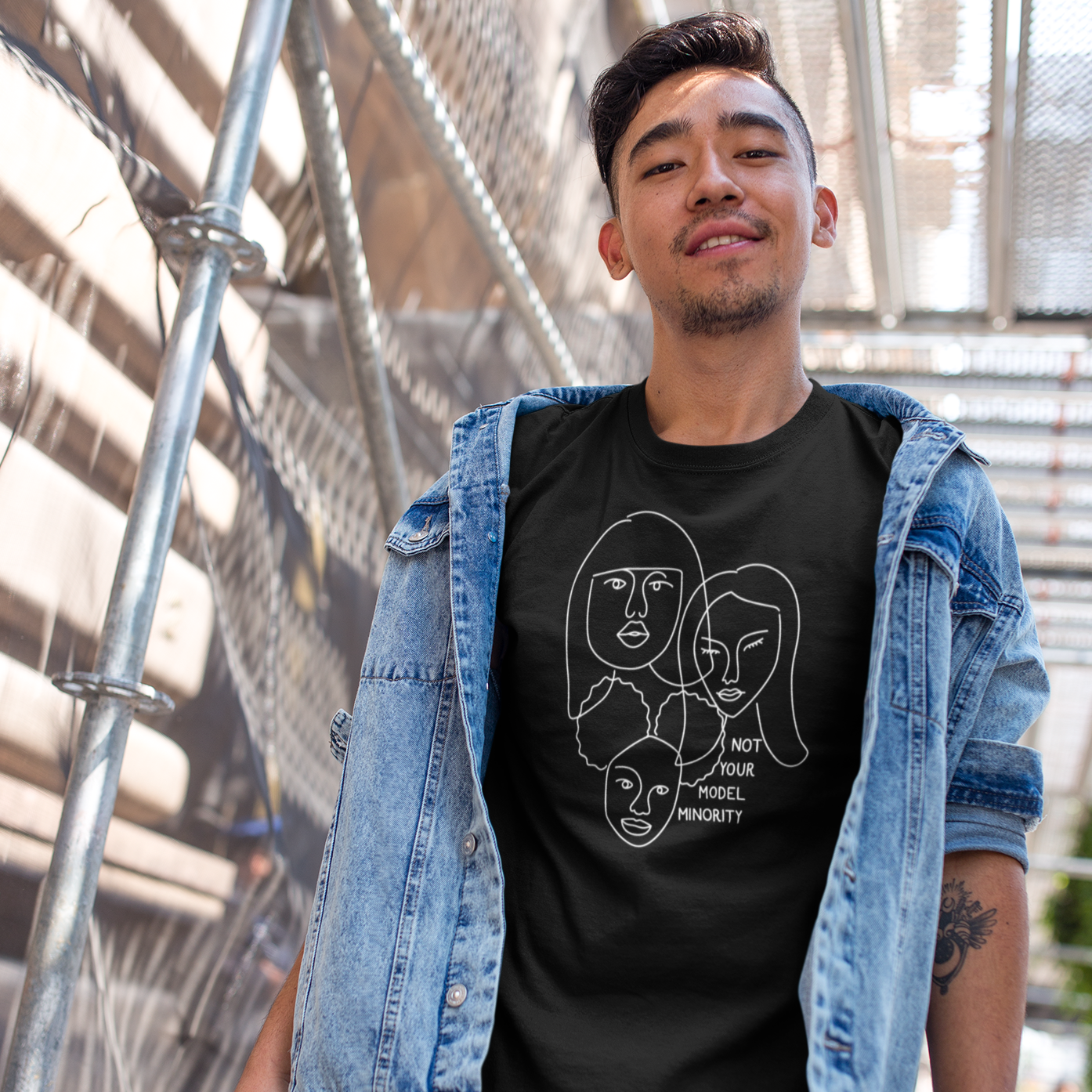 Person wearing Not Your Model Minority Tee