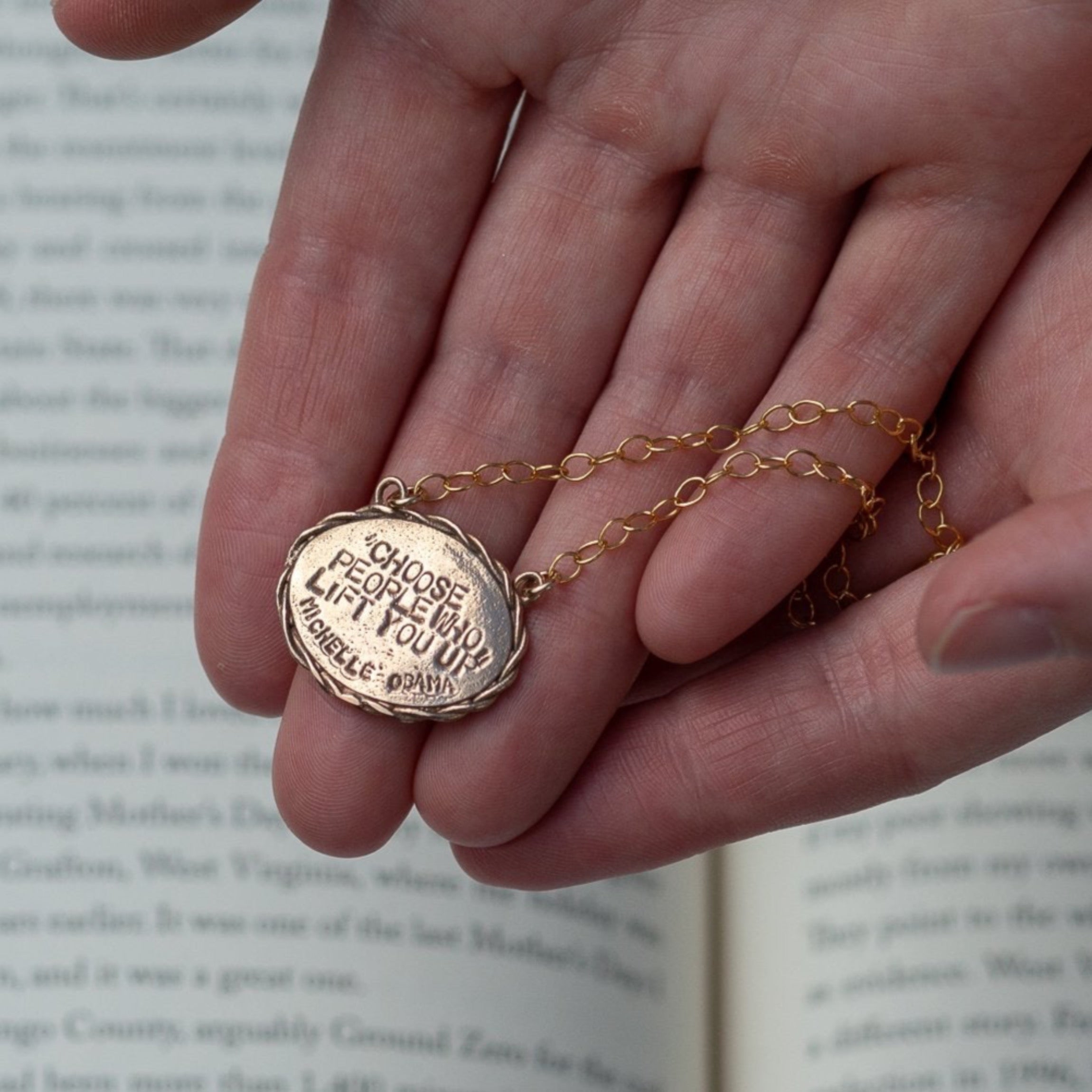 Bronze oval necklace with "Choose People Who Lift You UP" Michelle Obama