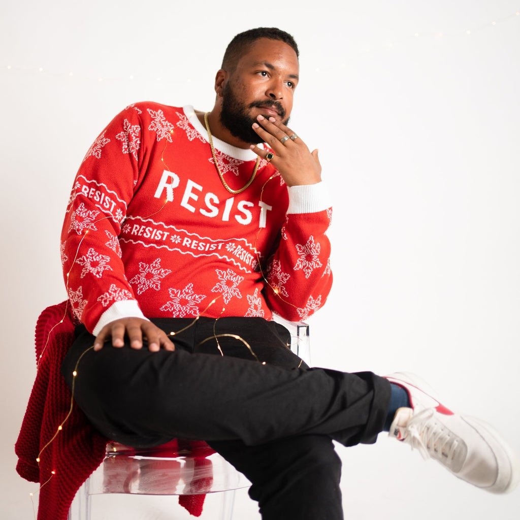 Person wearing Resist ugly sweater