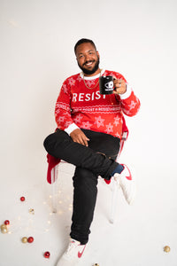Person wearing resist ugly holiday sweater