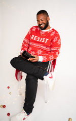 Load image into Gallery viewer, Person wearing resist ugly holiday sweater
