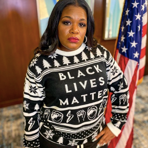 Cori Bush in Black Lives Matter Ugly Holiday Sweater