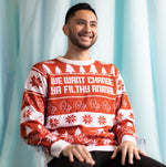 Load image into Gallery viewer, A person wearing the We Want Change Holiday Sweater. There is an ice blue background.
