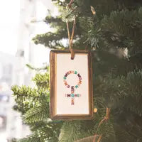 Female sign ornament on a tree