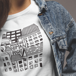 Load image into Gallery viewer, Person wearing Housing Is A Human Right Tee
