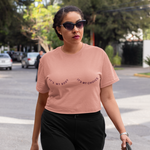 Load image into Gallery viewer, A photo of a woman wearing the It&#39;s My Body It&#39;s My Choice Boxy Crop. It&#39;s a dusty pink color shirt with a burgundy print.
