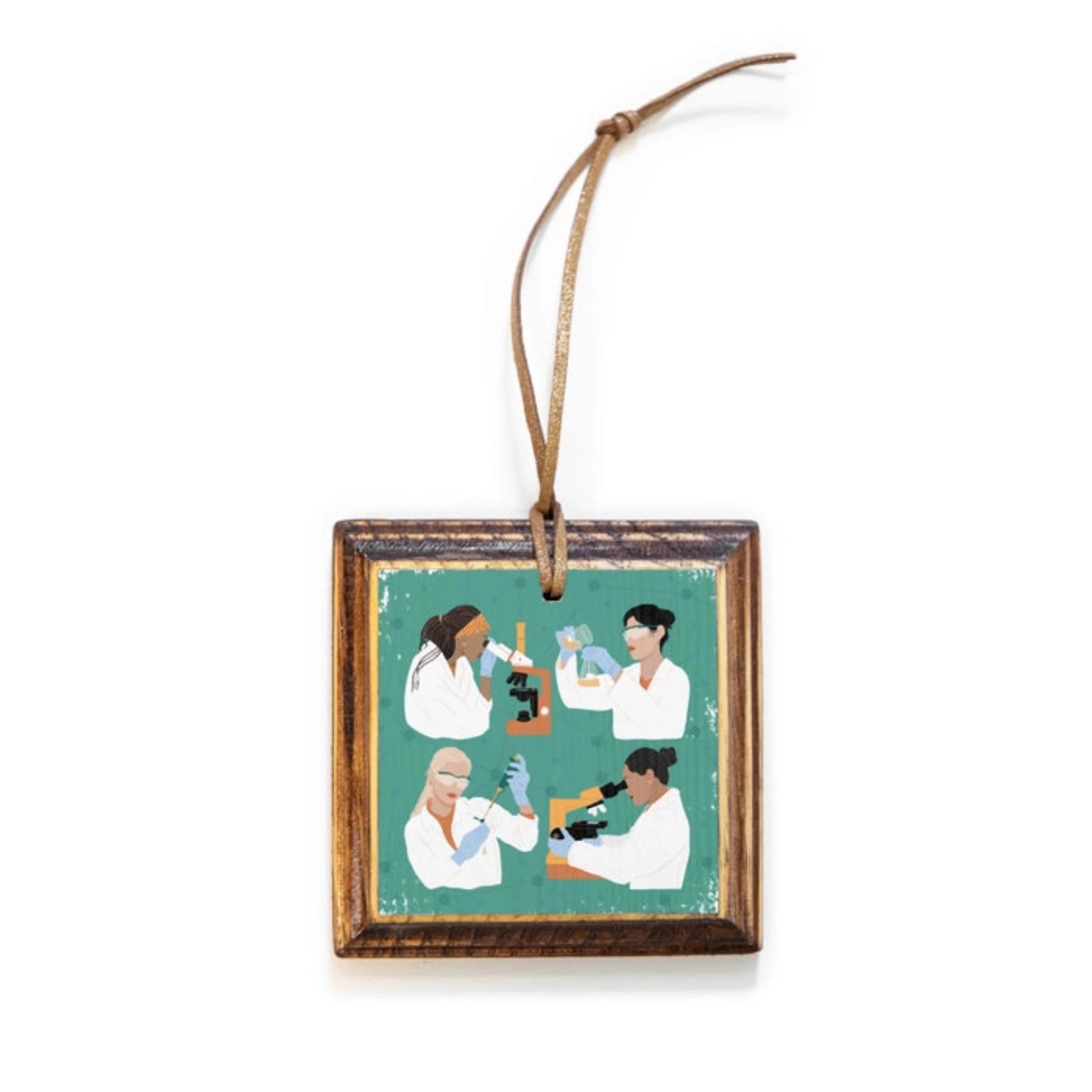 Square wooden ornament with four diverse women in lab coats with scientific equipment on a teal background