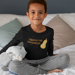 Photo of little boy wearing the Squash The Patriarchy long sleeve tee.