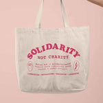 Load image into Gallery viewer, Solidarity Not Charity tote bag
