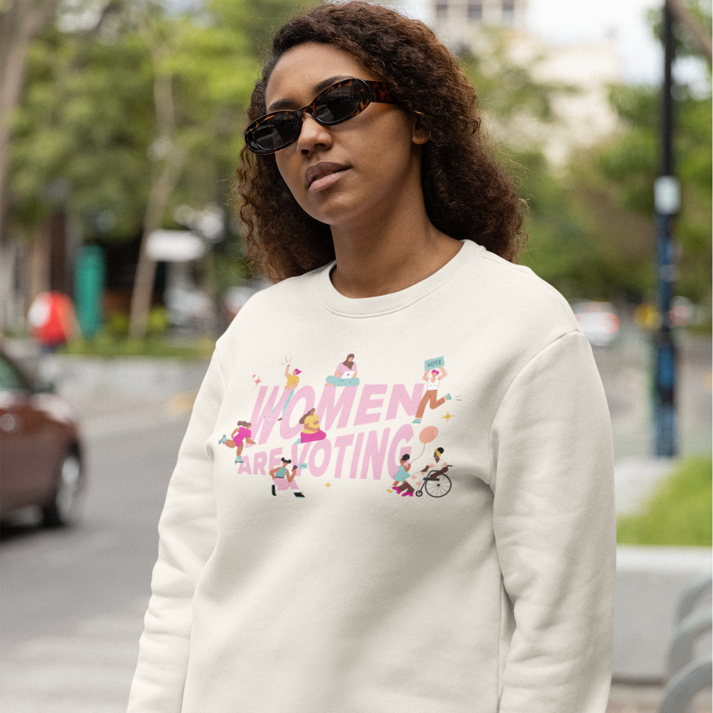 Photo of a person wearing the Women Are Voting Crewneck Sweatshirt.