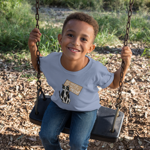 little boy on a swing wears light blue shirt with "We Need Equality Meow" design