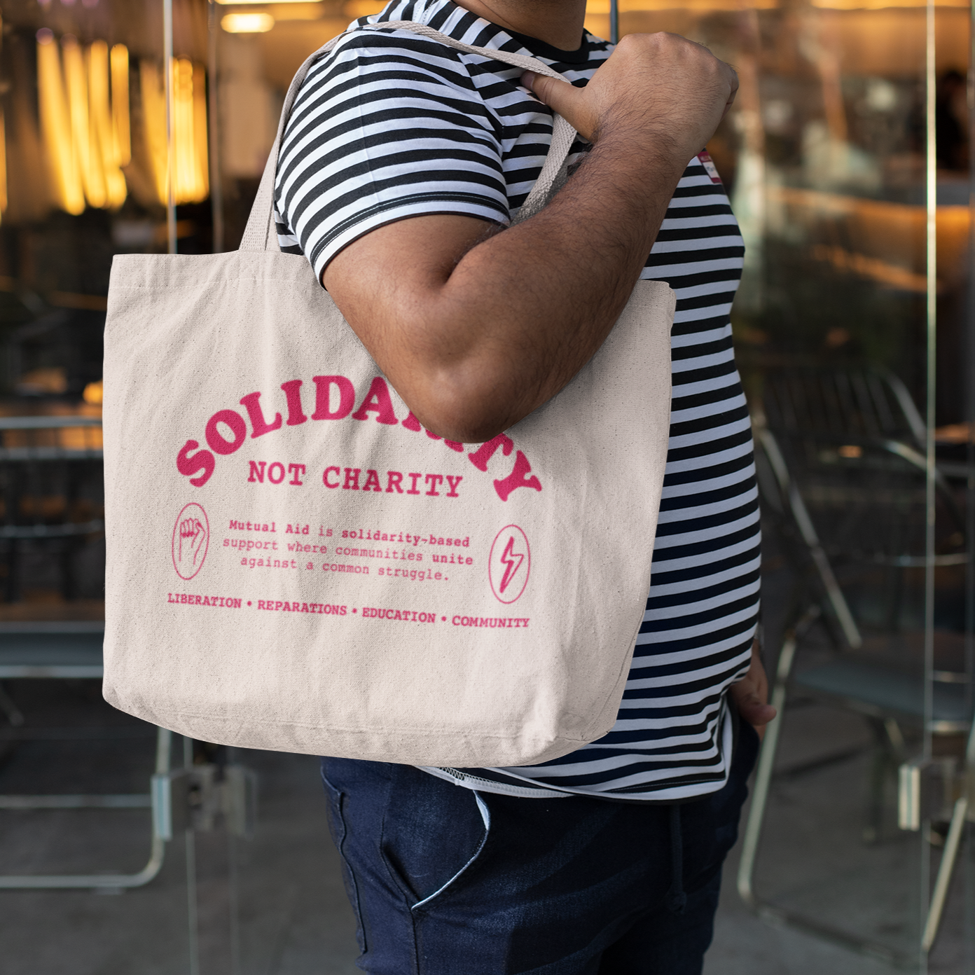 Solidarity Not Charity tote bag